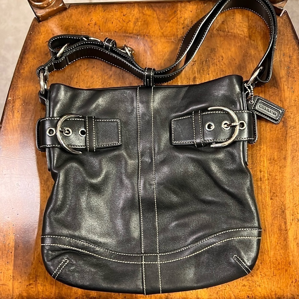 Coach handbag. Black all leather Coach purse with two silver buckles.